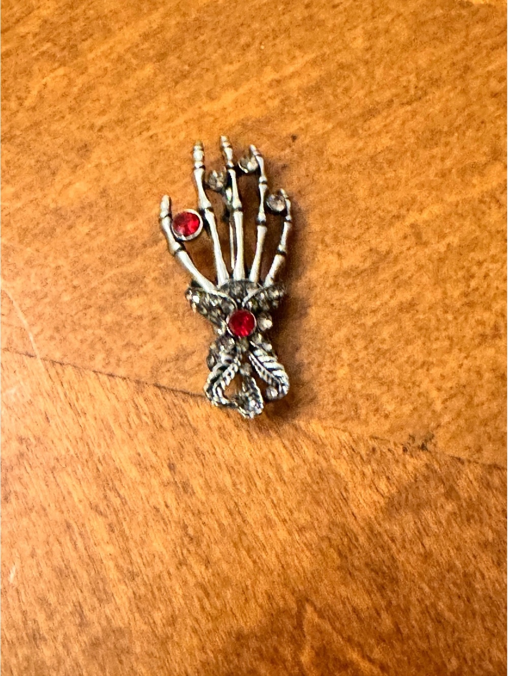 Vintage Skeleton Hand Brooch with Red Gemstones